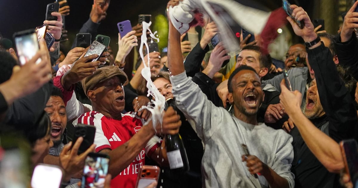 Arsenal fans feel the joy of European soccer's season of wild and historic title